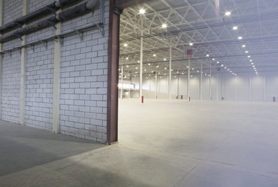 Access door to brightly lit and empty warehouse