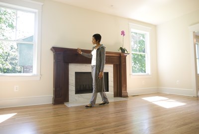 Woman admiring fireplace in her new home