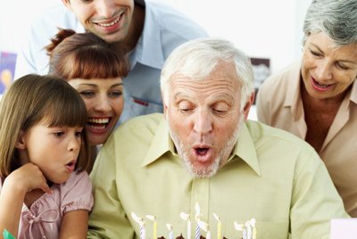 man celebrating his birthday his wife and son