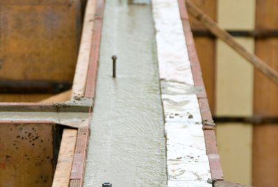 Concrete setting inside wall molds at construction site
