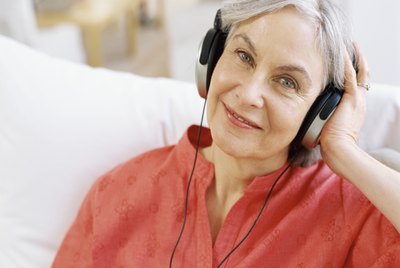 close-up of a senior woman wearing headphones