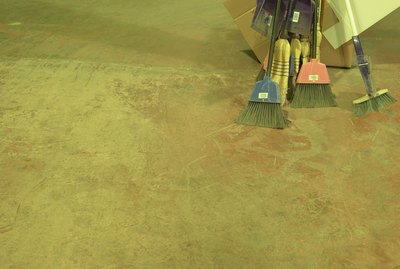 Brooms on concrete floor