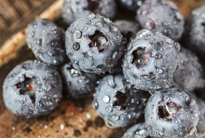 Wet fresh Blueberry on wooden background