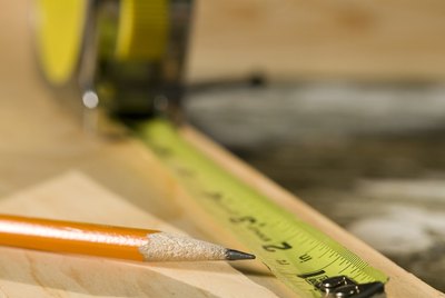 Tape measure, pencil, and wood
