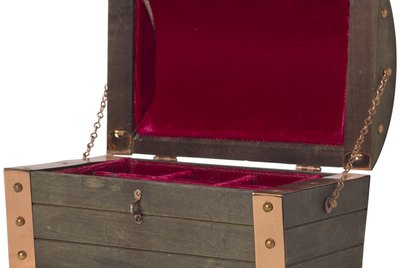Open wood chest lined in velvet