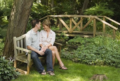 Couple sitting on park bench