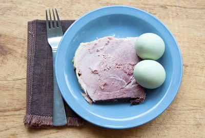Green eggs and ham with fork, napkin