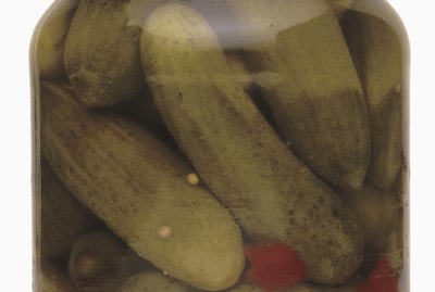 pickled cucumber and chilies in a closed jar