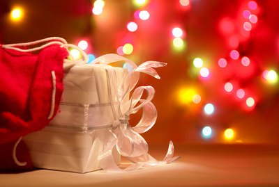 Package by colorful Christmas lights