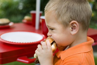Boy eating hamburger