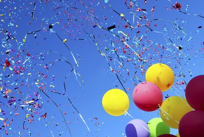 multicolored balloons and confetti