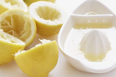 Lemon halves by juice squeezer, close-up
