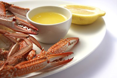 Crab legs with melted butter and lemon