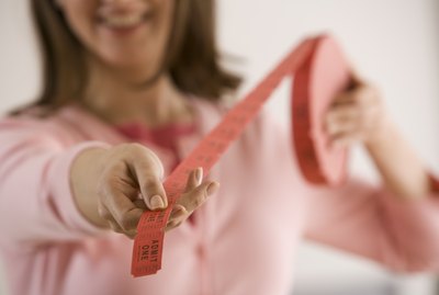 Woman holding roll of admission tickets