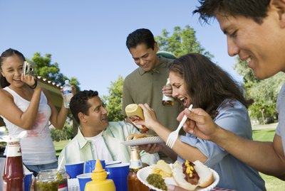 Family Gathered Around Picnic Table