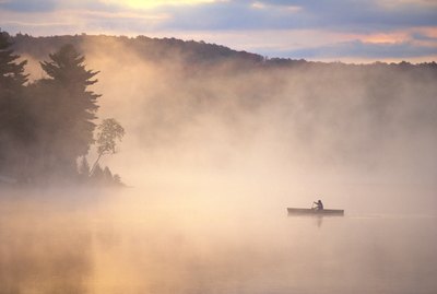 Canoe on a foggy lake