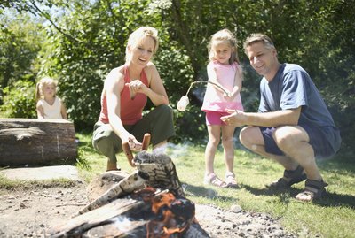 Family gathered around the campfire
