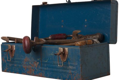 Rusty tool in blue metal box L2