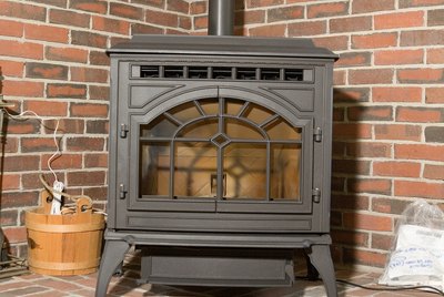 Wood stove in brick corner