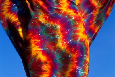 Female torso wrapped with tie dye scarf