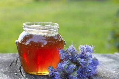 honey on wooden garden table