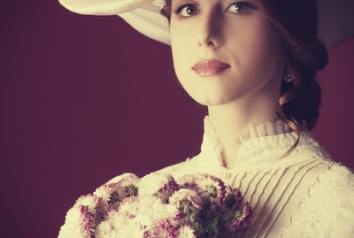 Beautiful redhead women with bouquet
