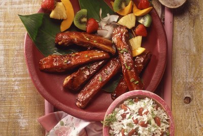 BBQ ribs with fruit kabobs and rice