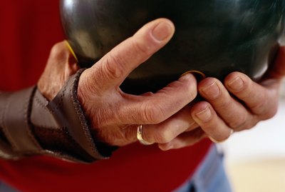 Close-Up of a Man Holding a Bowling Ball