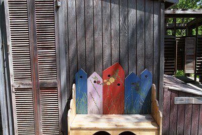 Decorative wooden bench on porch