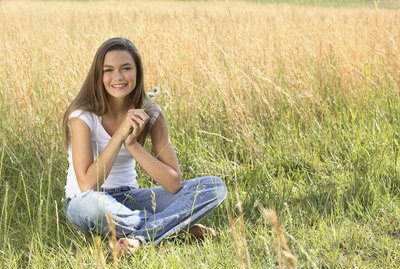 Portrait of girl sitting in grass