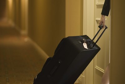 Woman pulling suitcase