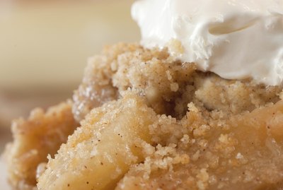 Dish Of Apple Crisp with Whipped Cream Topping