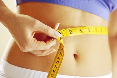 Woman measuring waist
