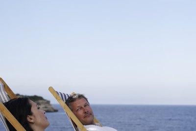 Man and woman look out to sea