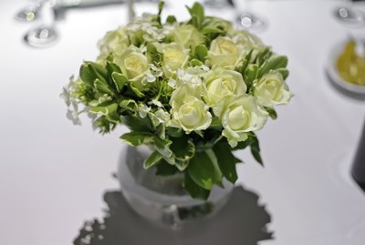 White roses in a glass vase.