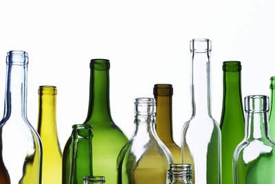 Empty glass bottles on white background