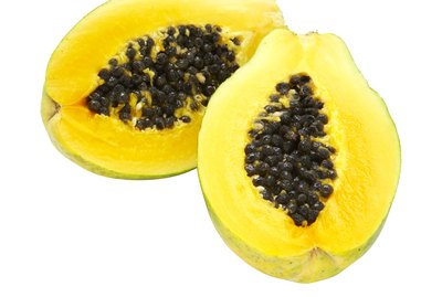 Papaya slices on white background