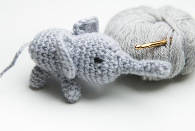Hand crocheted elephant with wool, crochet needle