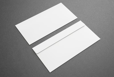 Blank envelopes on dark background. Front and back side.