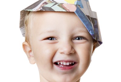 child smile with carpenter hat