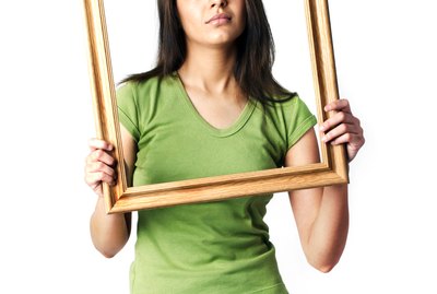 A woman holding a photo frame