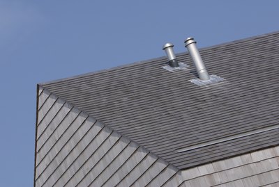 Ventilation pipes on roof of building