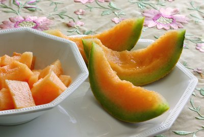 lucious canteloupe or musk melon in a white china dish