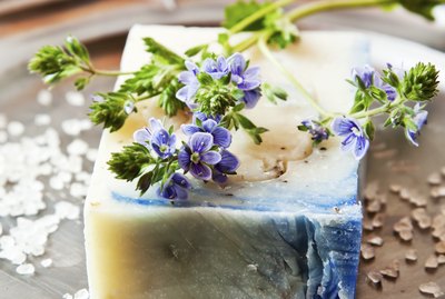 Decorate homemade soap with dried lavender sprigs before giving it as gifts.