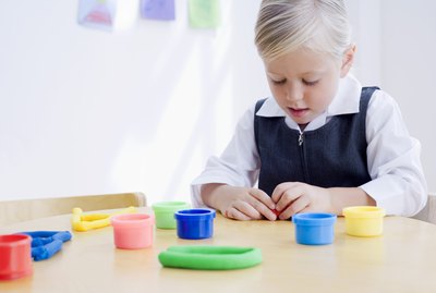 Girl playing with clay