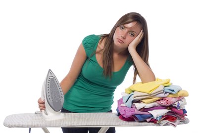 Girl with iron and laundry