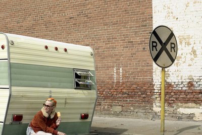 woman eating ice cream on trailer bumper