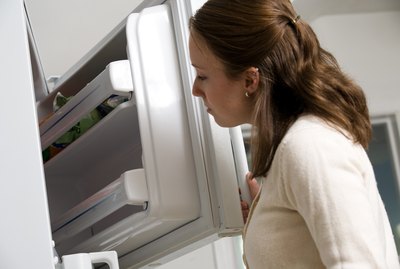 Woman looking in freezer