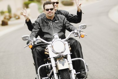 Couple riding motorcycle