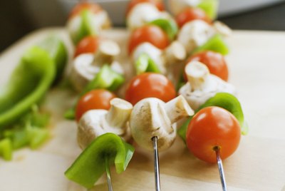 Shish kabobs on cutting board